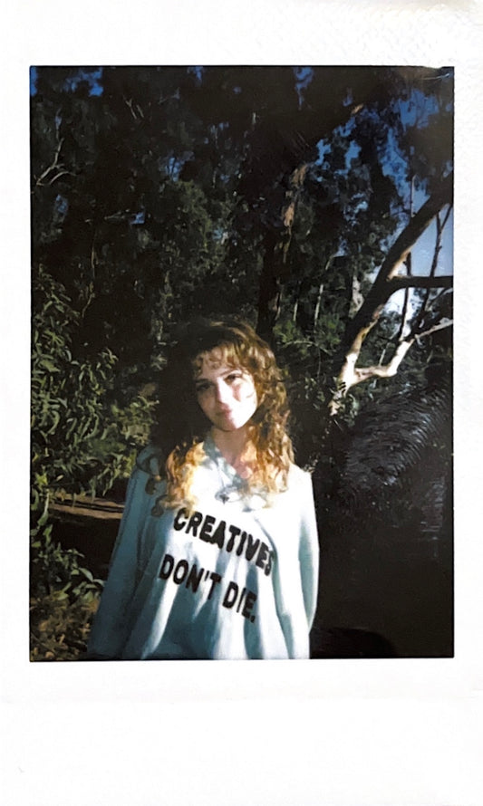 green ‘creatives’ sweater